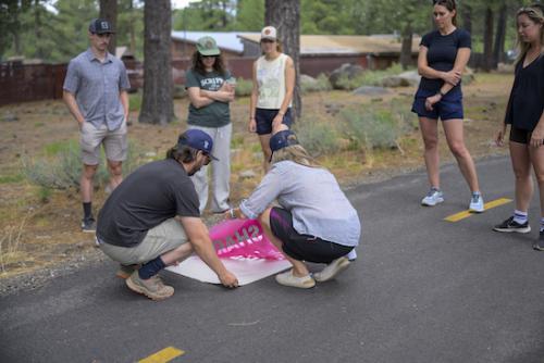 719232-stencilinstall3-townoftruckee Featured image showing representatives of the Trail Etiquette Stencil Initiative stenciling reminders on Truckee Trails.