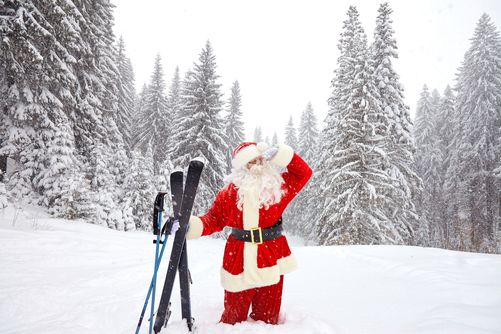 Featured image showing Santa Claus skier with skis in the woods in winter