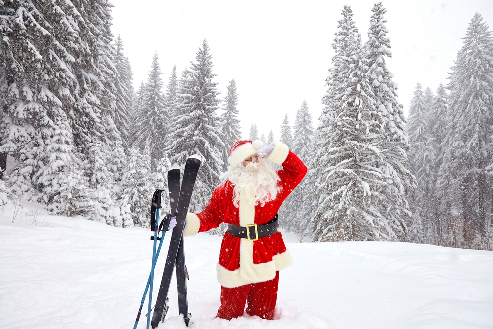 Santa,Claus,Skier,With,Skis,In,The,Woods,In,Winter Featured image showing Santa Claus skier with skis in the woods in winter