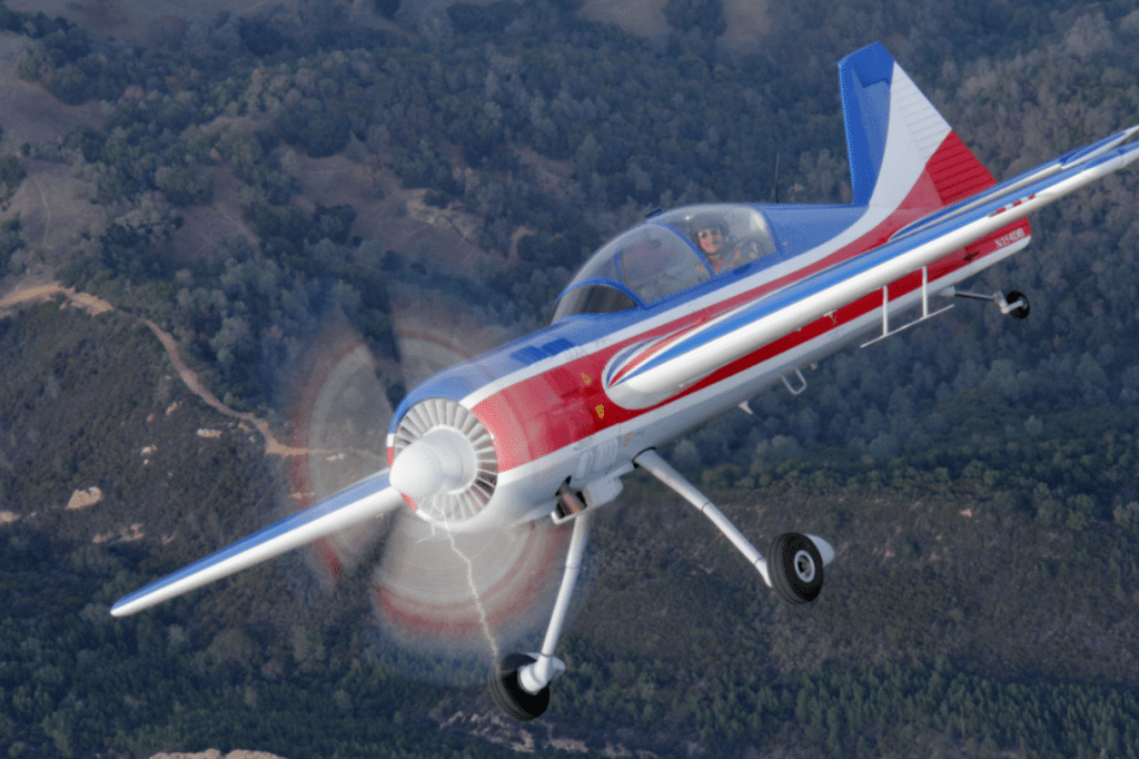 Truckee Tahoe Air Show Featured image showing a close up of a pilot in a cessna flying high over the Sierra Mountains in Truckee, CA at the Truckee Tahoe Air Show and Family Festival.