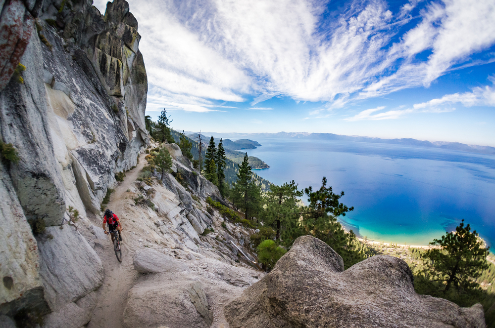 Mountain,Biker,On,The,Flume,Trail,At,Lake,Tahoe,,Ca. Featured image showing a mountain biker on the Flume Trail at Lake Tahoe